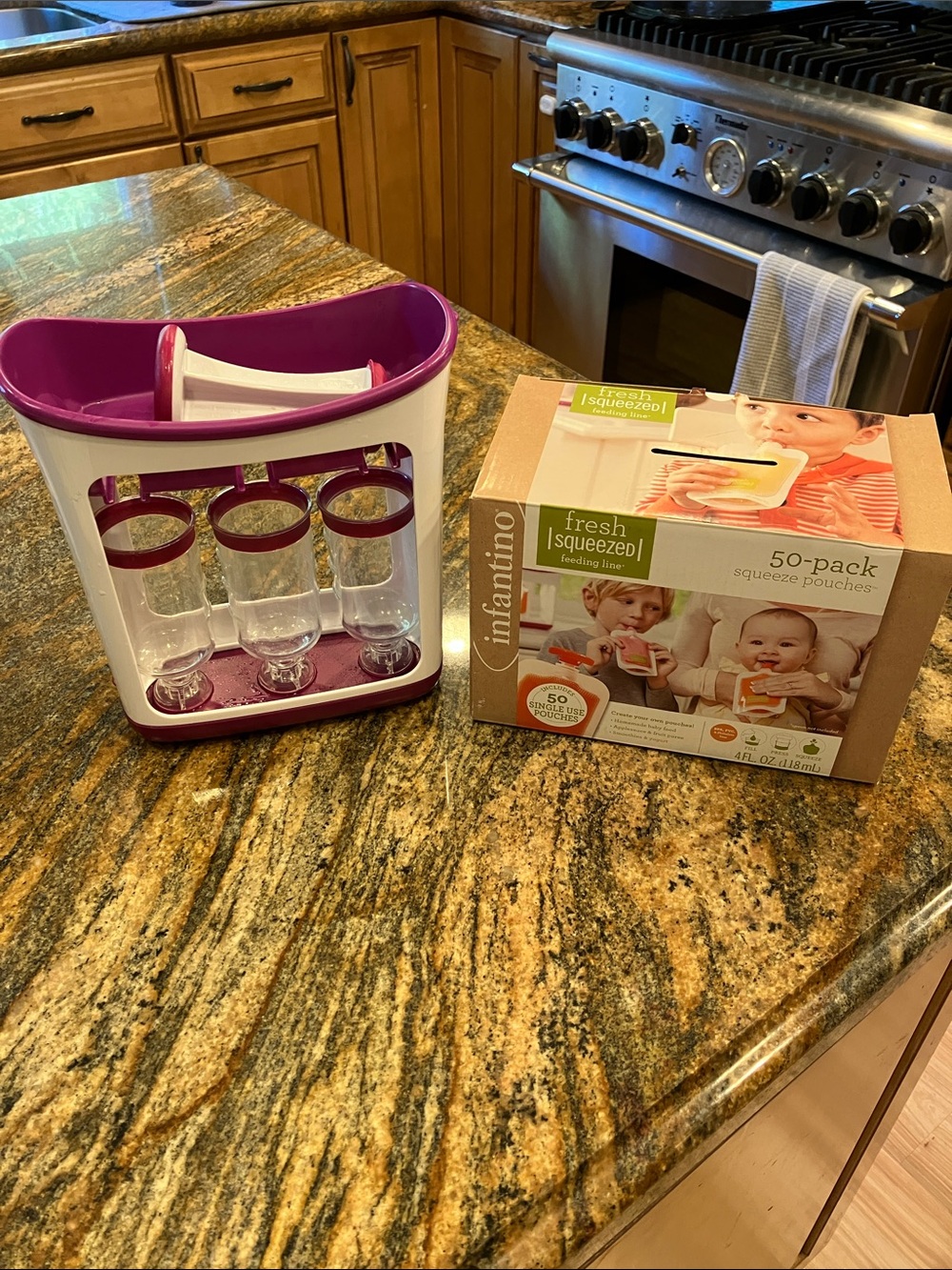 Infantino purple and white baby food pouch holder and filler